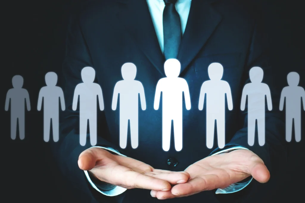 Business professional holding team icons, symbolizing the balance between leadership and management in PMP certification roles